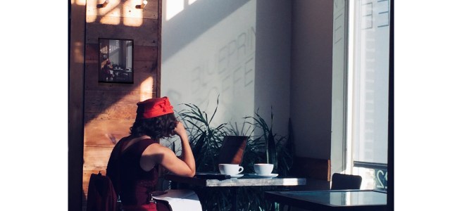 Photo from 2018 of young mysterious lady in local coffeehouse.